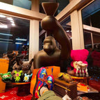 Gorilla floor lamp with an adjustable arm