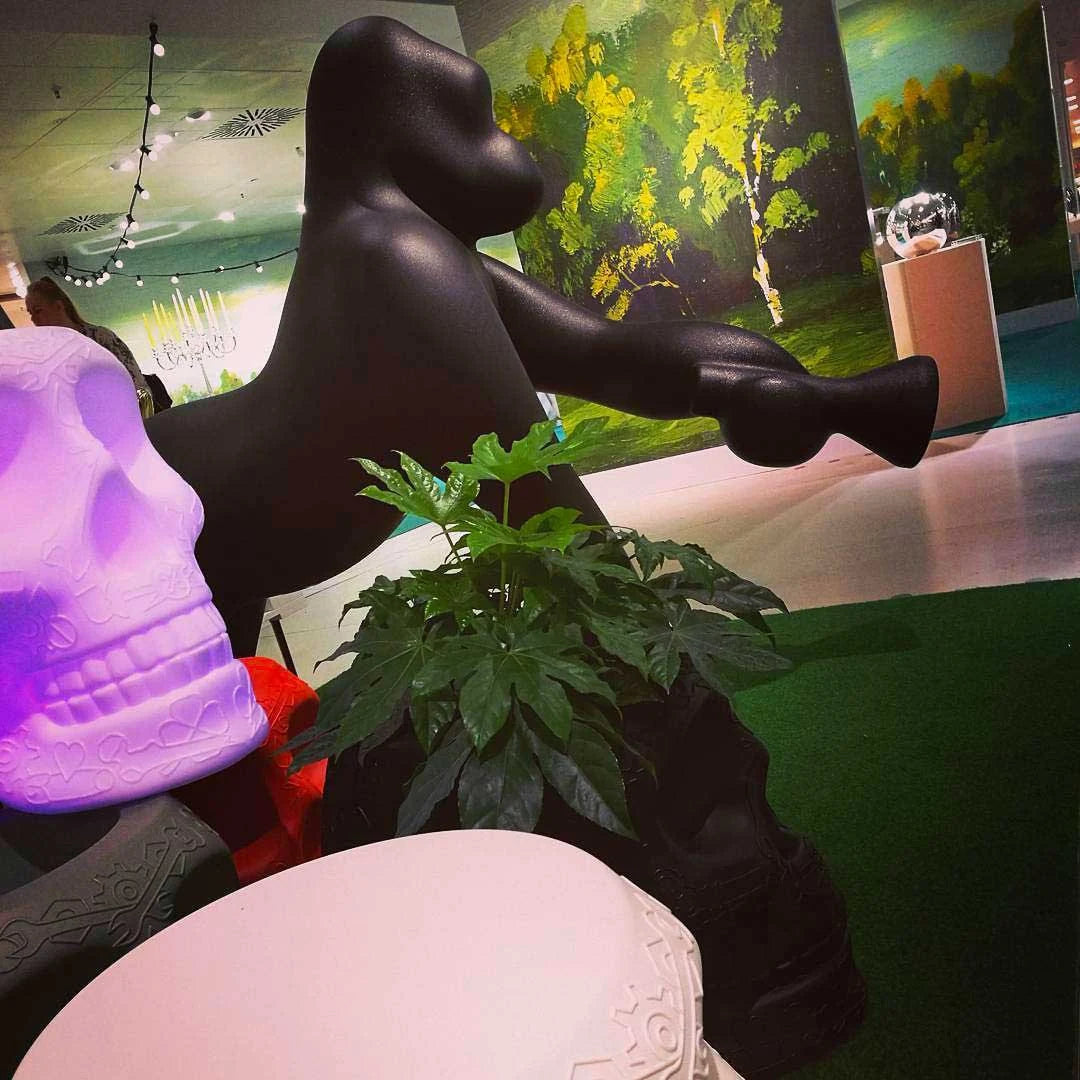 Gorilla floor lamp with an adjustable arm