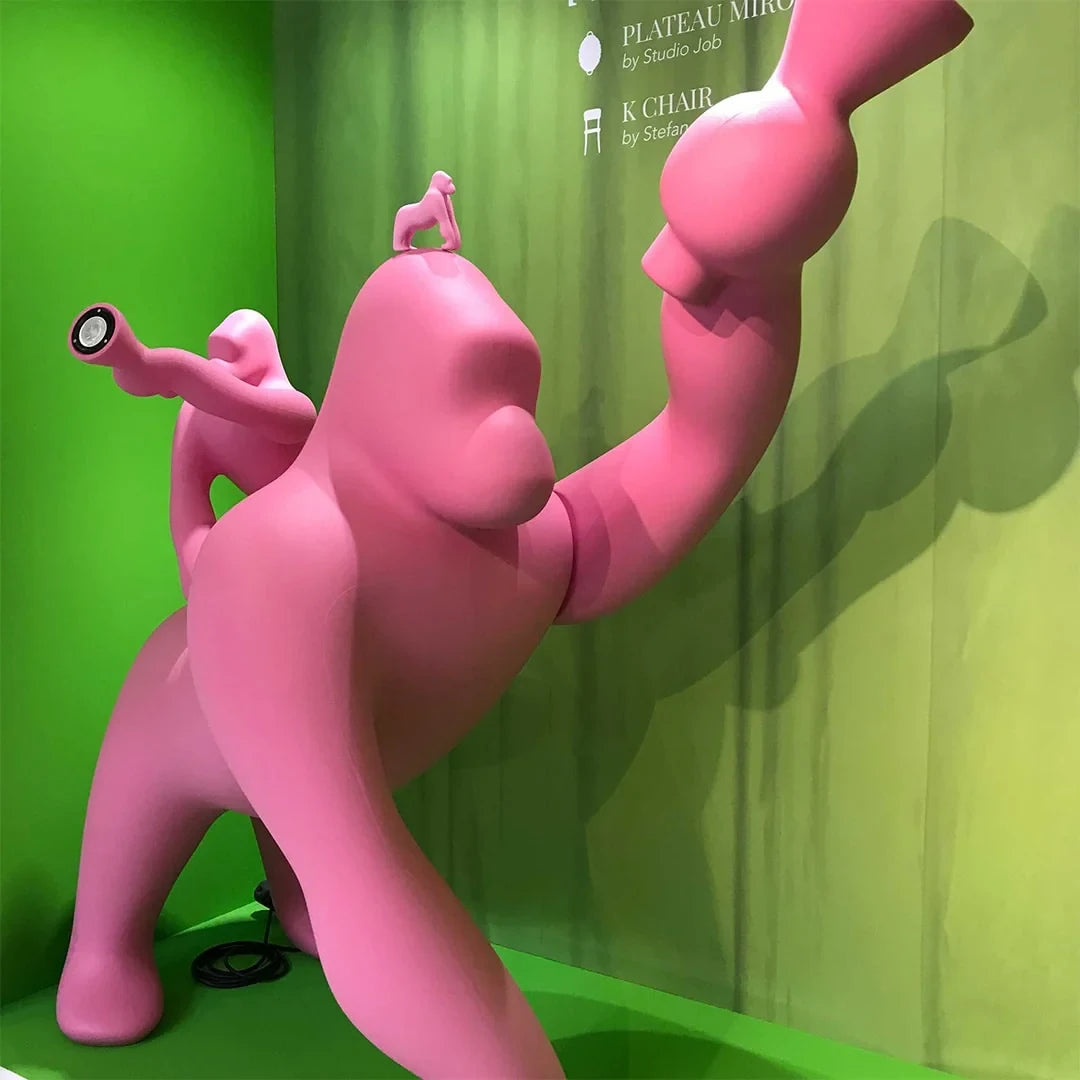 Gorilla floor lamp with an adjustable arm