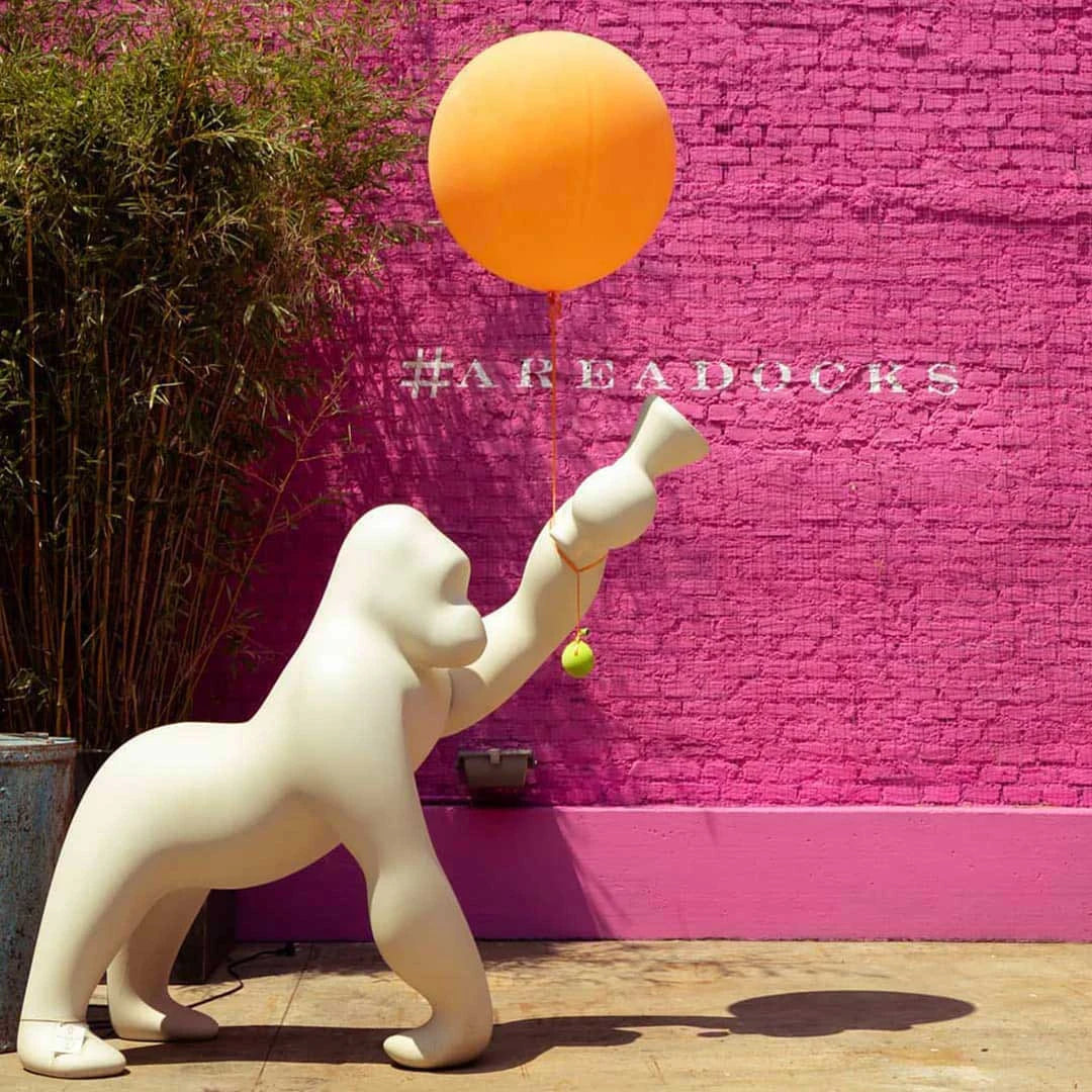 Gorilla floor lamp with an adjustable arm