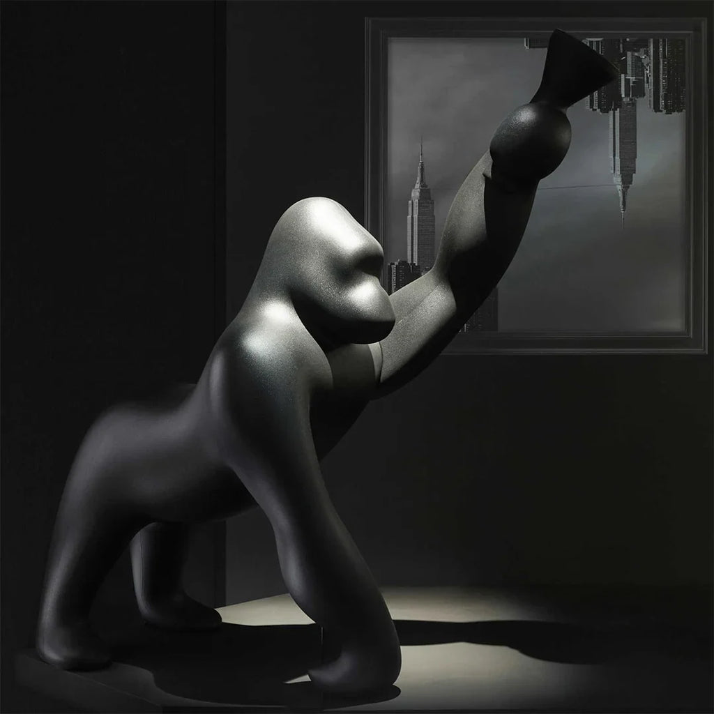 Gorilla floor lamp with an adjustable arm
