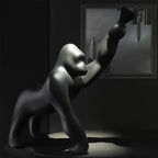 Gorilla floor lamp with an adjustable arm