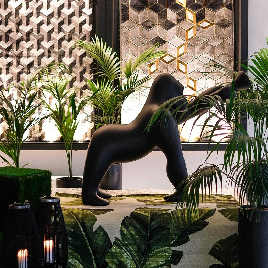 Gorilla floor lamp with an adjustable arm