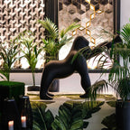 Gorilla floor lamp with an adjustable arm