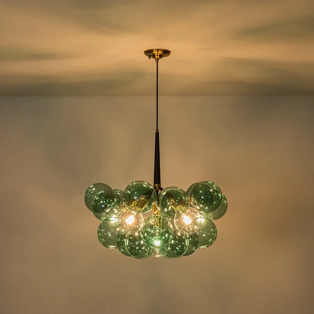 Green glass bubble chandelier, lit against the ceiling
