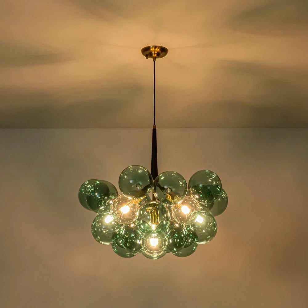 Green glass bubble chandelier, lit against the ceiling