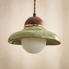 Green glass pendant light with walnut cap