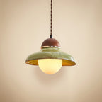 Green glass pendant light with walnut cap