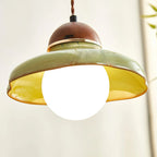 Green glass pendant light with walnut cap