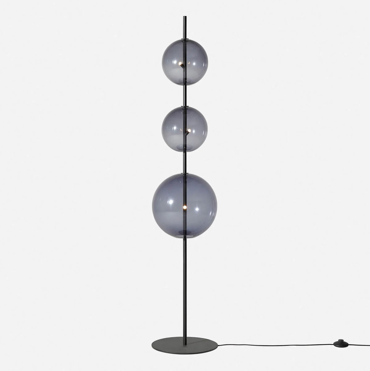 Modular hand-blown glass globe floor lamp, in black with smoke grey glass