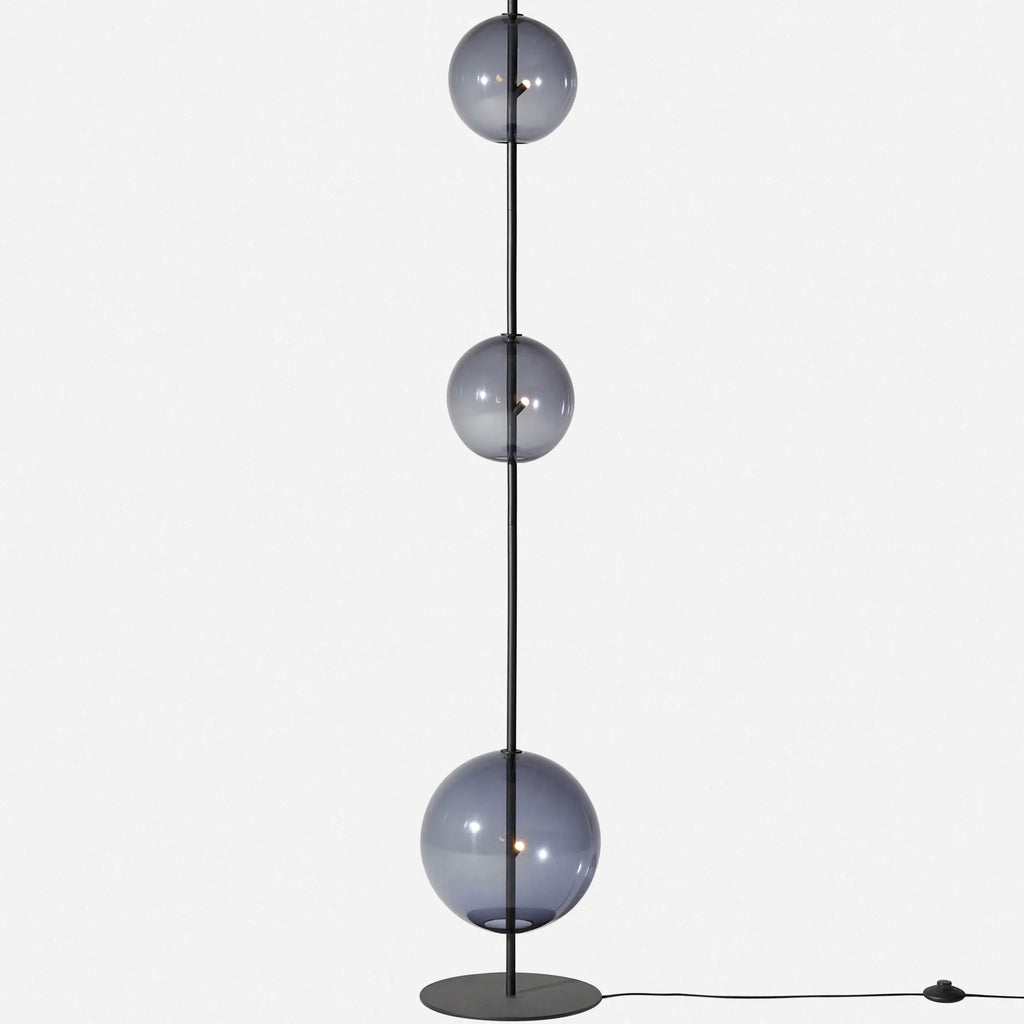 Modular hand-blown glass globe floor lamp, in black with smoke grey glass