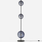 Modular hand-blown glass globe floor lamp, in black with smoke grey glass
