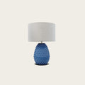 Hand-painted bobble glass table lamp with drum shade, in blue on a plain background