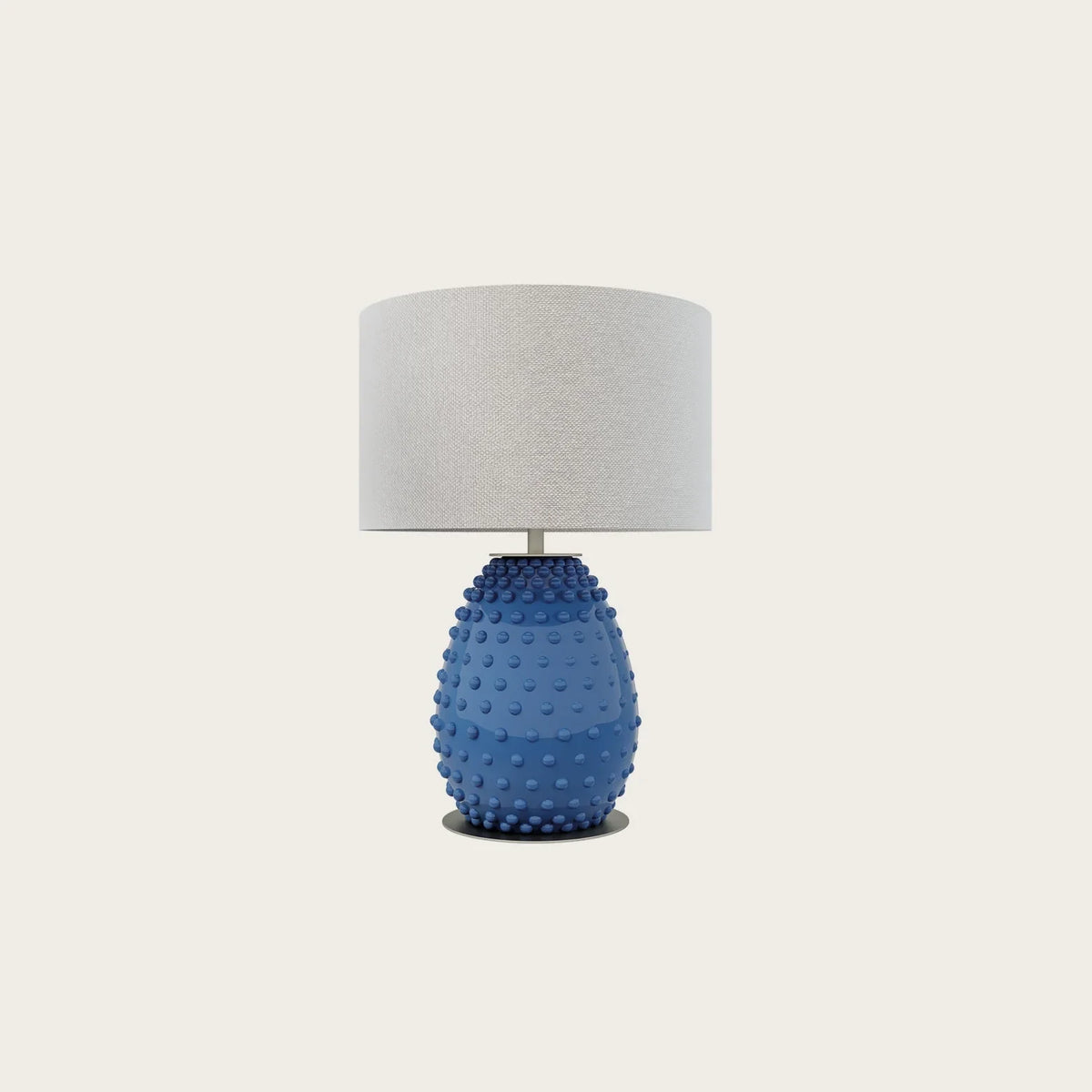 Hand-painted bobble glass table lamp with drum shade, in blue on a plain background