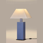 Hand-painted ceramic square column table lamp, in blue, lit, with a white shade (sold separately)