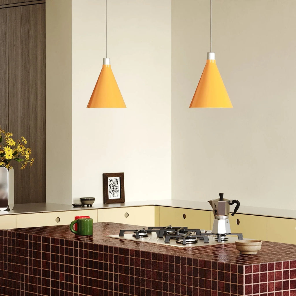 Small yellow hand-spun steel cone pendant, two above a kitchen island