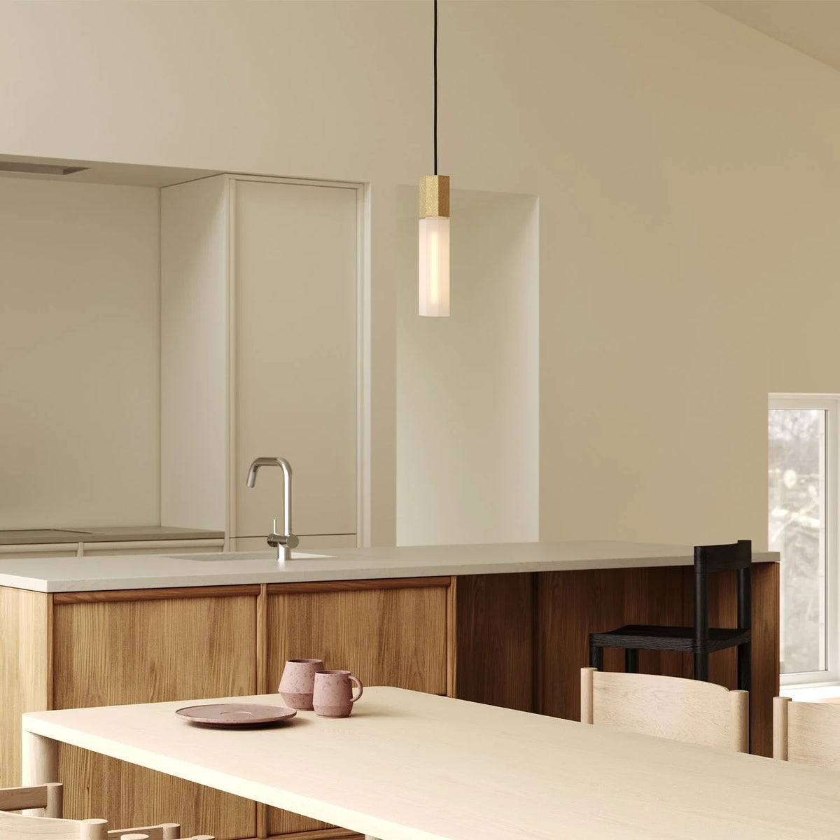 Hexagonal cast brass pendant with glass bulb, in a kitchen