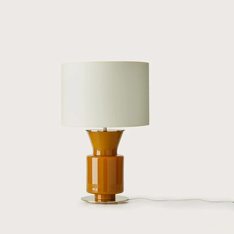 Honey glass chalice table lamp with metal disc foot, with a white drum shade (sold separately)