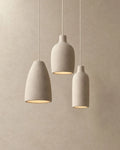 Knitted-texture pendant light, trio of three shapes
