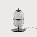 Lantern-style linen shade table lamp, black marble base, close-up of the shade and marble base