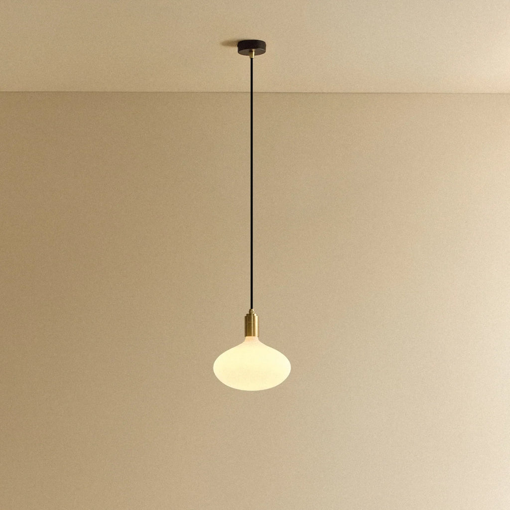 Large opal oval bulb pendant, lit against a plain wall