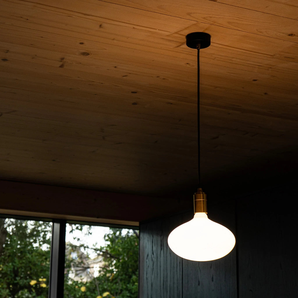 Large opal oval bulb pendant, under a timber ceiling