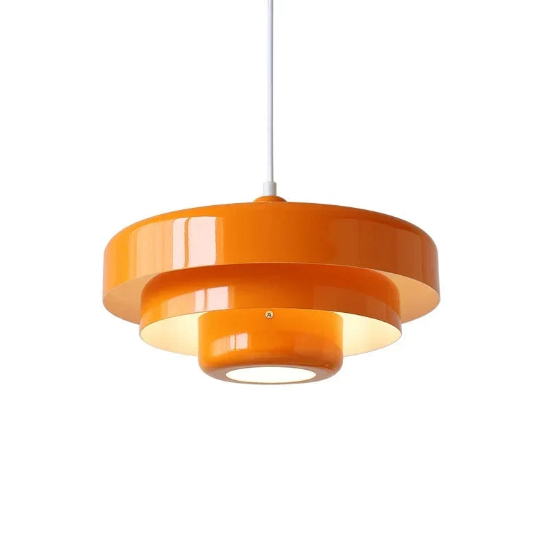 Layered metal pendant light, in orange, lit
