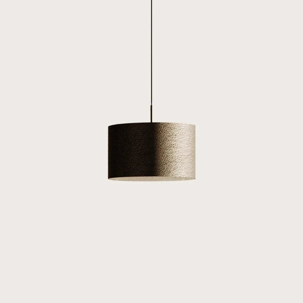 Leather drum pendant, on a plain background