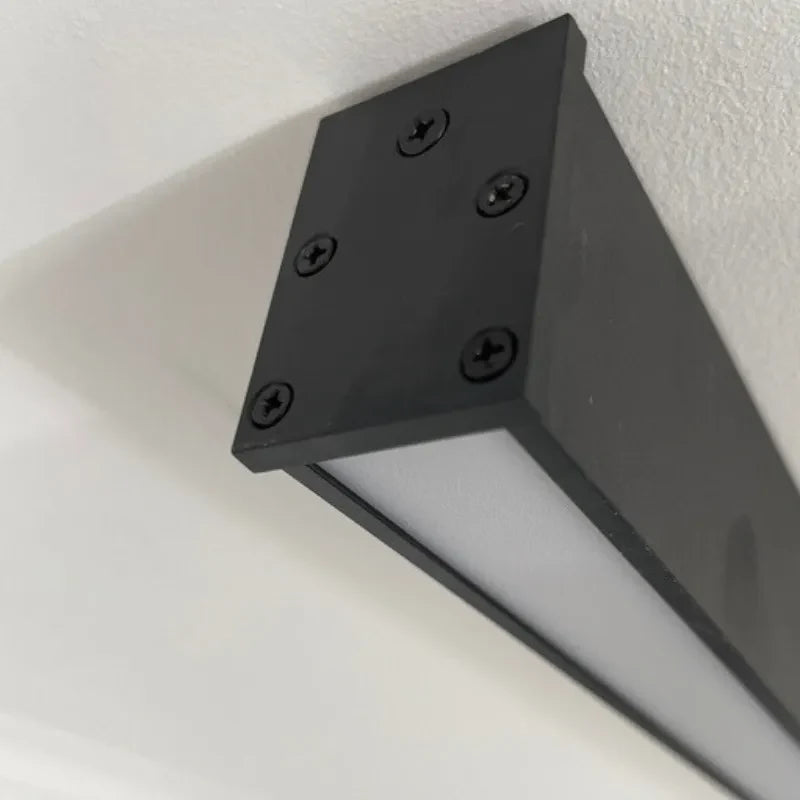 Linear black LED ceiling light, close-up of the end