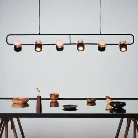 Linear frame LED pendant, in black above a table