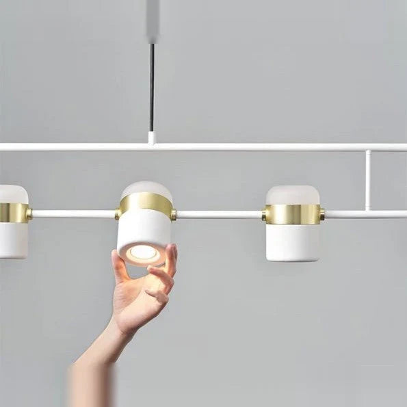 Linear frame LED pendant, in white, close-up held in a hand
