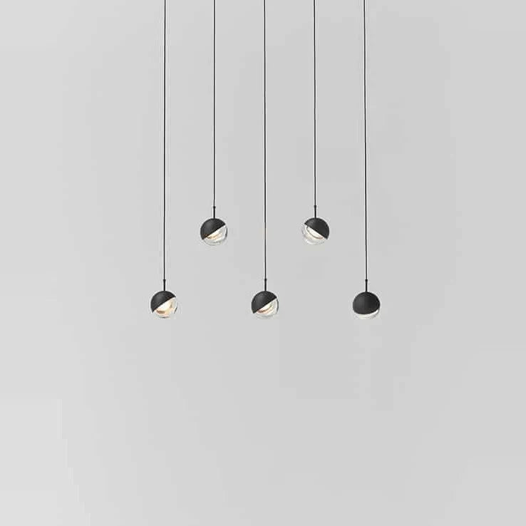 Linear glass globe pendant, five lights, in black, staggered