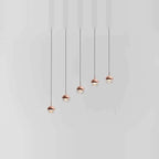 Linear glass globe pendant, five lights, in copper, stepped heights