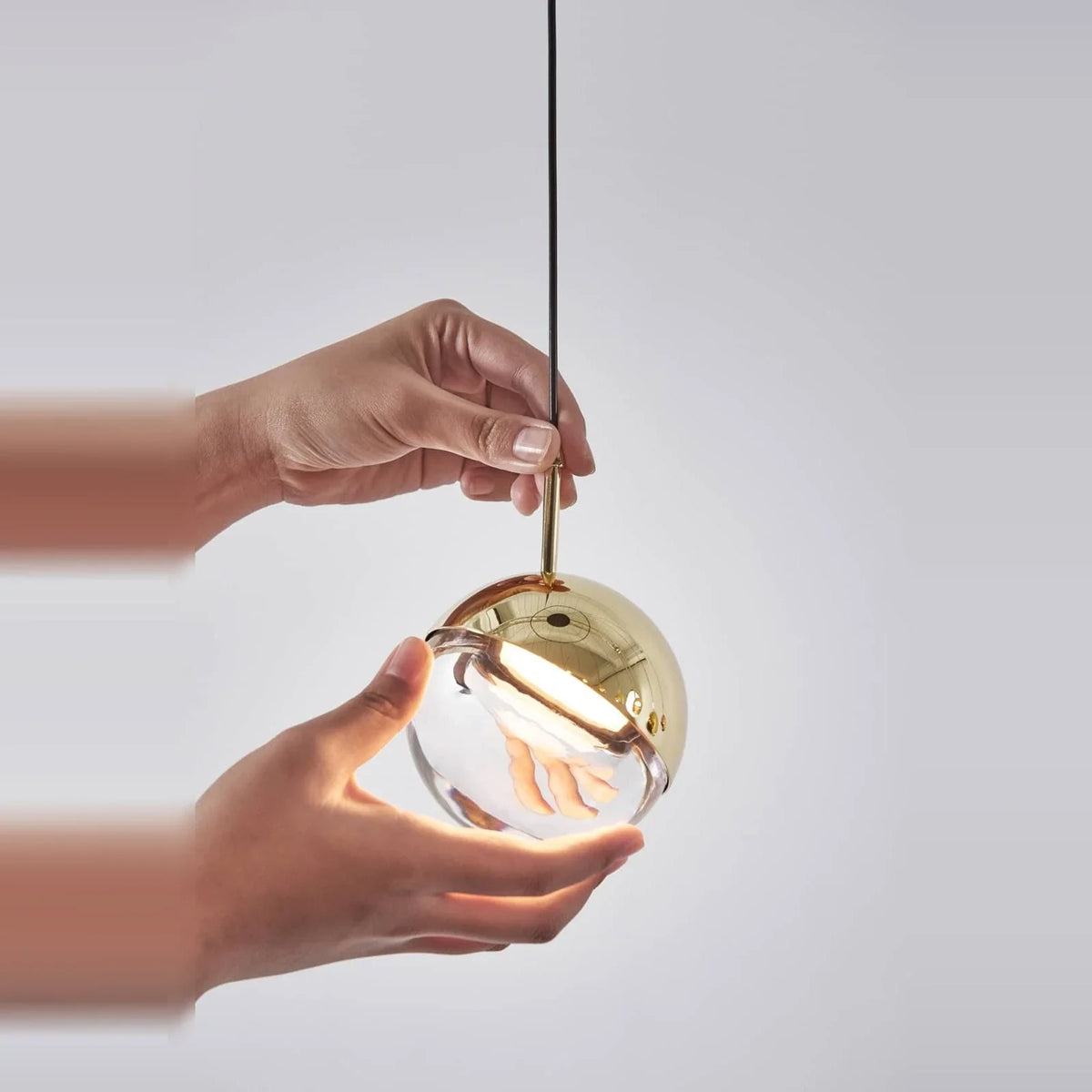 Linear glass globe pendant, five lights, single globe held in two hands