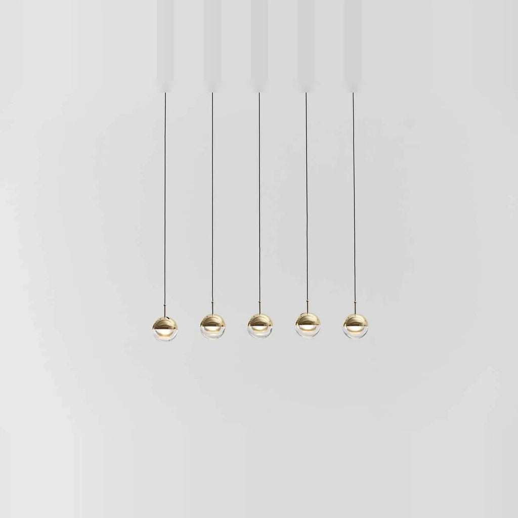 Linear glass globe pendant, five lights, in brass, in a row, low