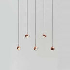 Linear glass globe pendant, five lights, in copper, staggered, front view