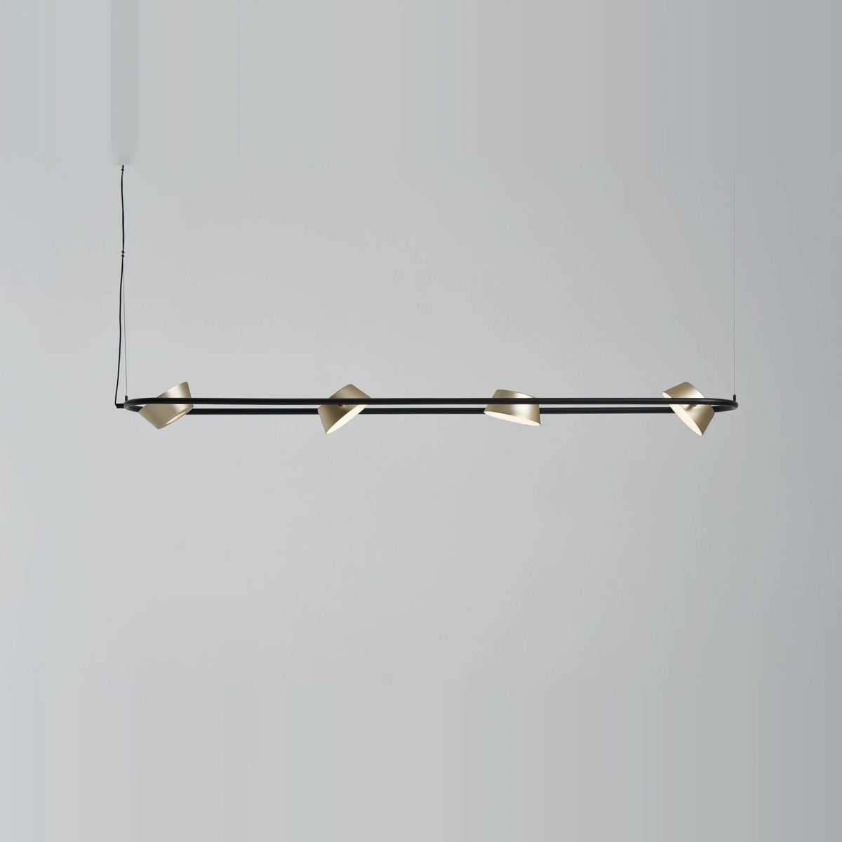 Linear LED pendant with four rotating shades, with champagne gold shades turned