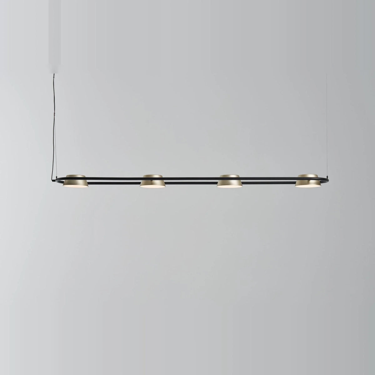 Linear LED pendant with four rotating shades, lit, shades pointing down