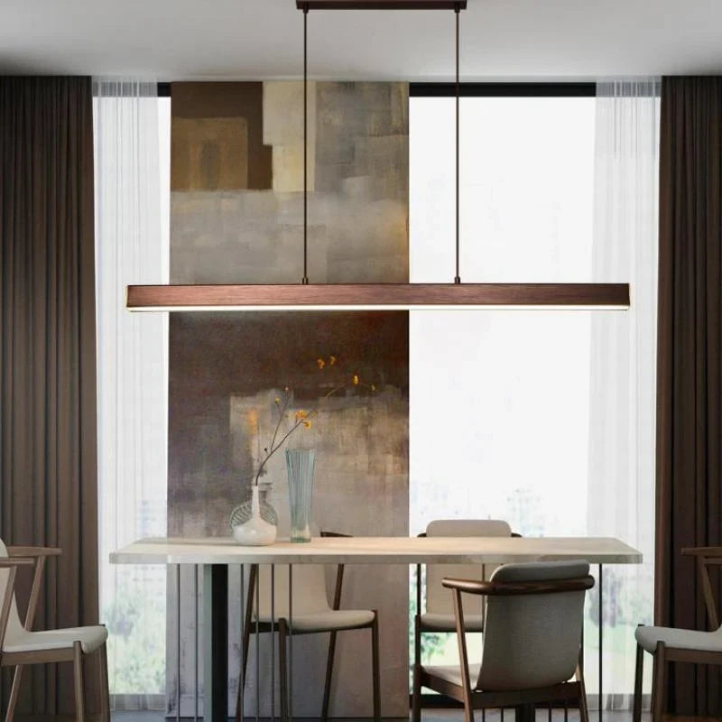 Linear LED pendant light, in brown, over a dining table