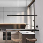 Linear LED pendant light, in black, in a modern kitchen