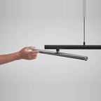 Linear LED pendant with three tilting bars, tilting a bar by hand