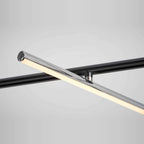 Linear LED pendant with three tilting bars, close-up of the lit bar