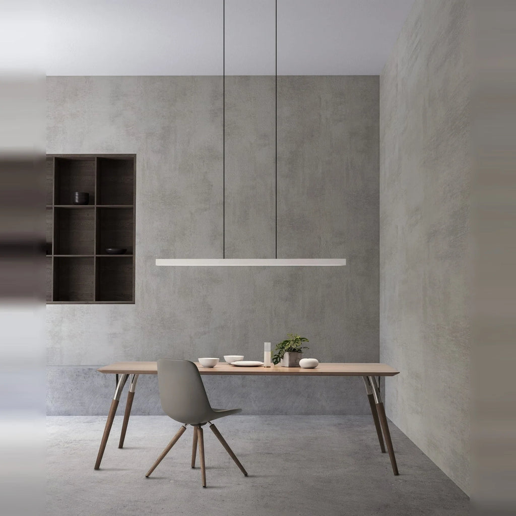 Linear LED pendant with touchless dimmer, in white above a dining table