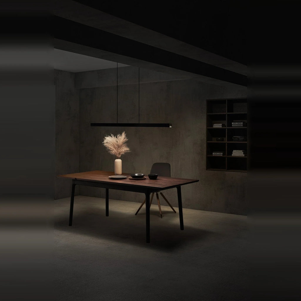 Linear LED pendant with touchless dimmer, lit above a dining table