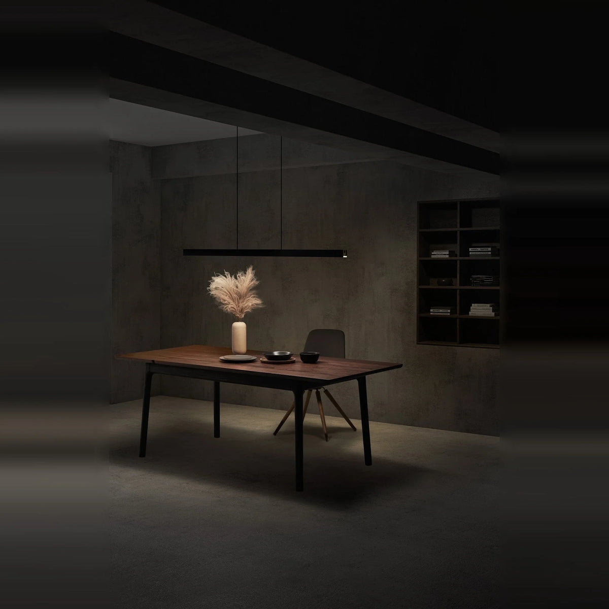 Linear LED pendant with touchless dimmer, lit above a dining table