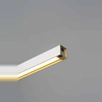 Linear LED pendant with touchless dimmer, close-up of the gold inner surface, lit
