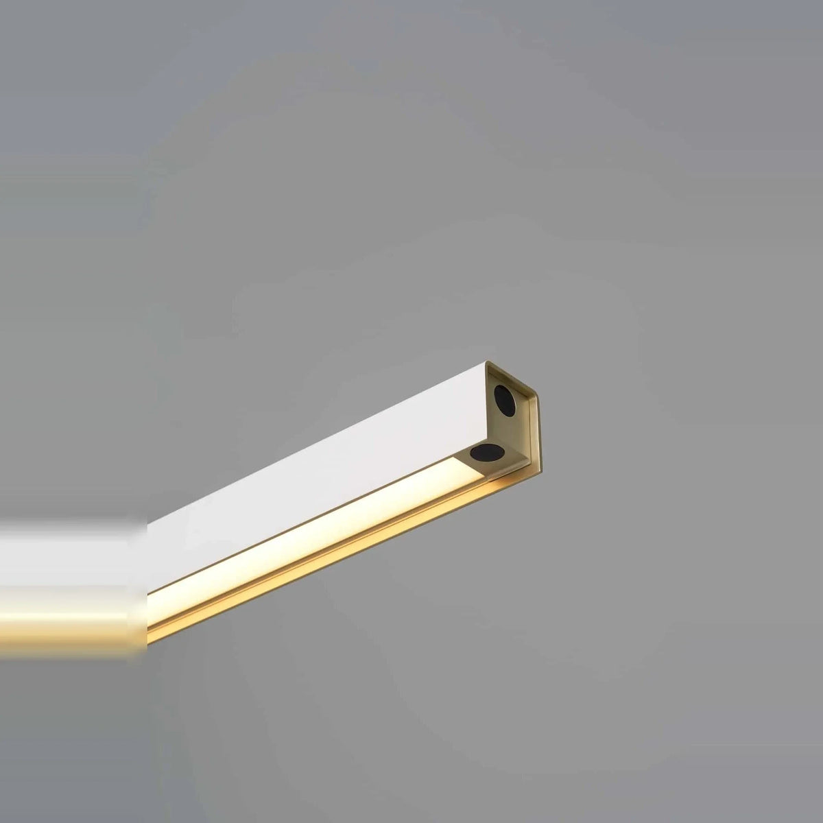 Linear LED pendant with touchless dimmer, close-up of the gold inner surface, lit