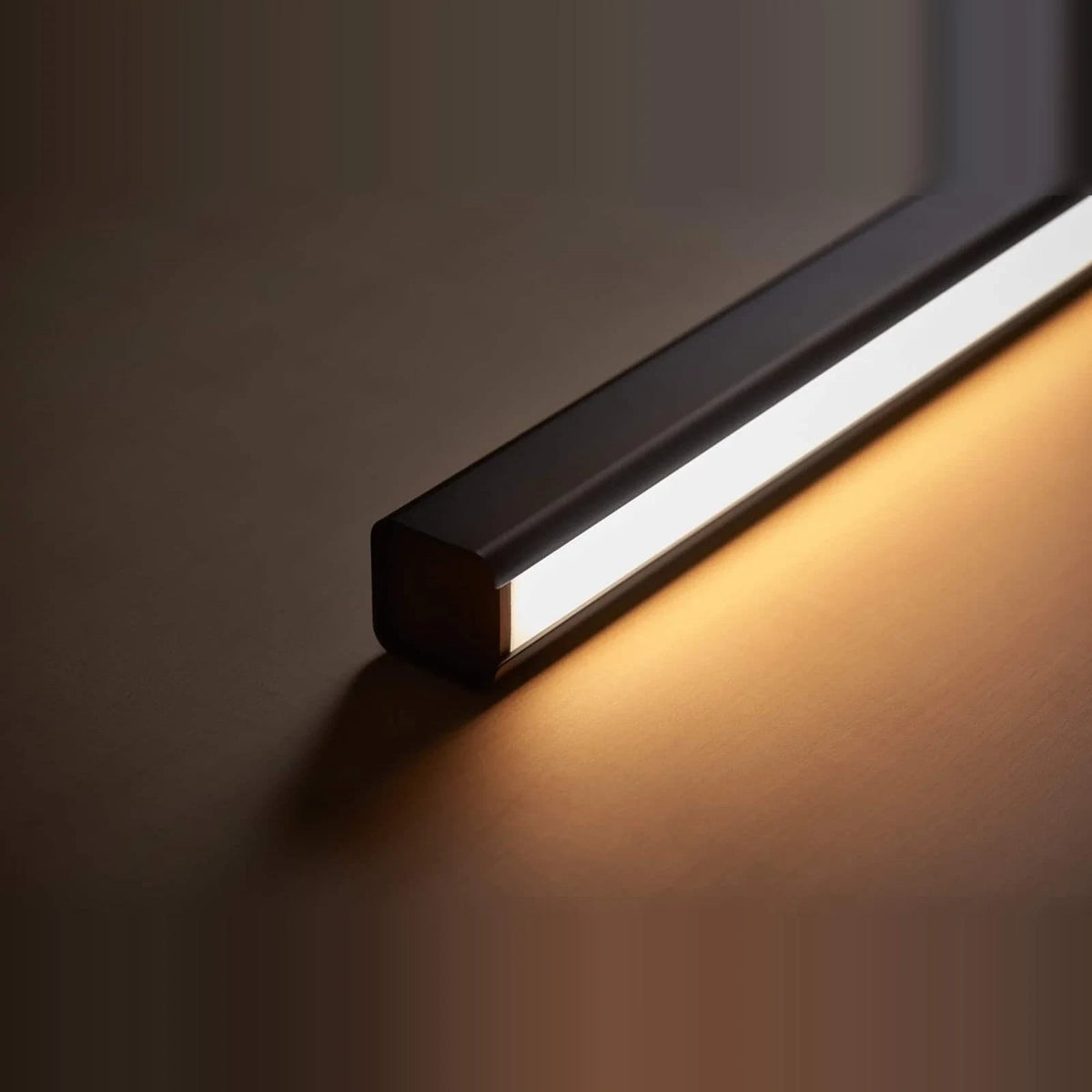 Linear LED pendant with wood ends, close-up of the lit LED strip