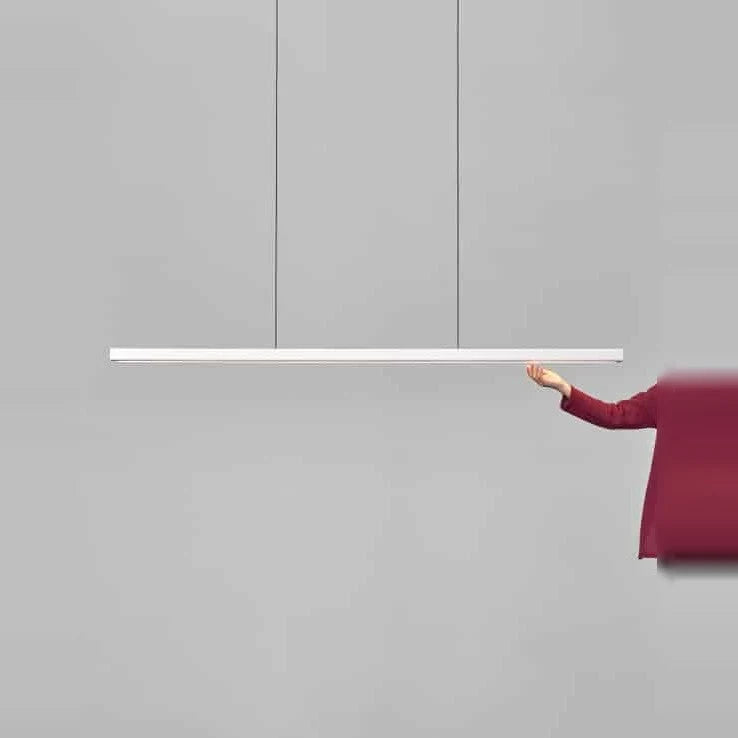 Linear LED pendant with wood ends, with a hand for scale