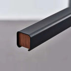 Linear LED pendant with wood ends, close-up of the walnut end cap